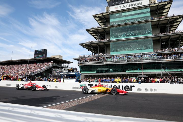 Josef Newgarden crosses the finish ahead of Marcus Ericsson, driver of the #8 Huski Chocolate Chip Ganassi Racing Honda. (Photo by Justin Casterline/Getty Images)